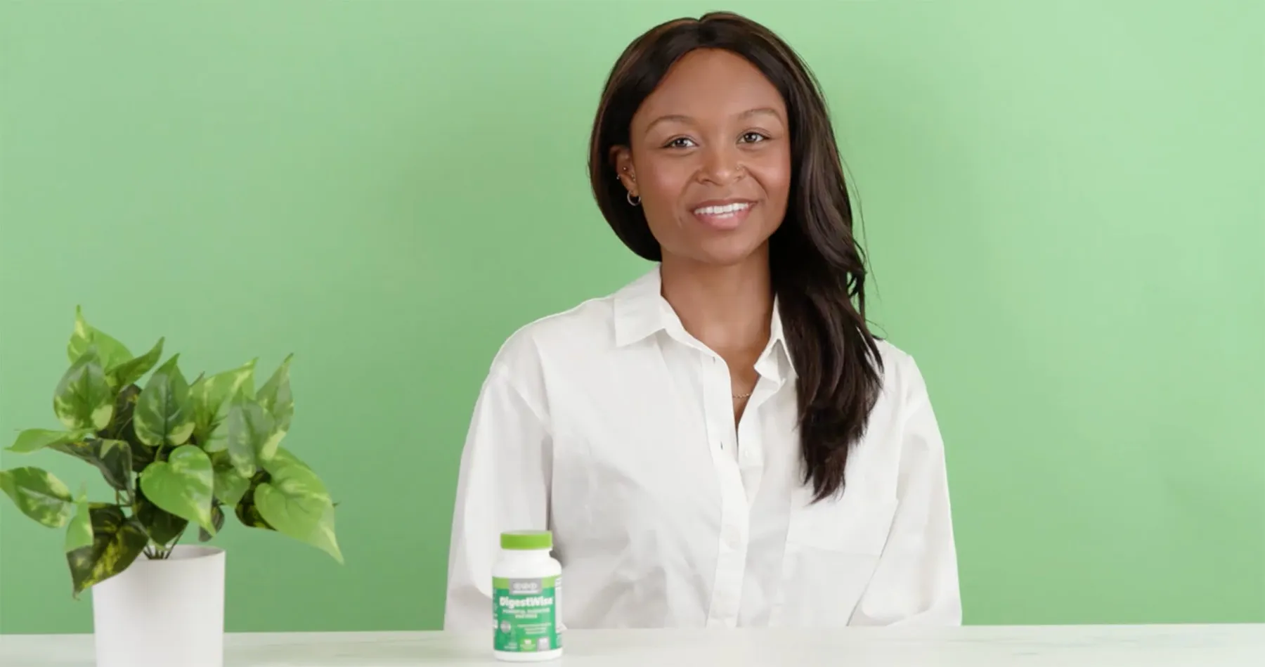 a woman on a green backdrop